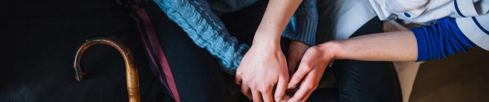 retirement-home-concept-with-nurse-woman-holding-hands